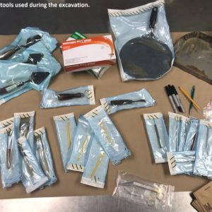 Table covered in plastic-sealed tools