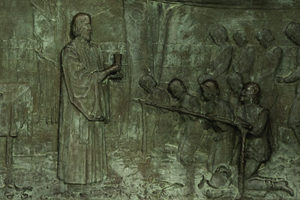 Detail of monument bas-relief showing reverend and congregation