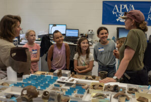 Campers learn about artifacts in the Vault.