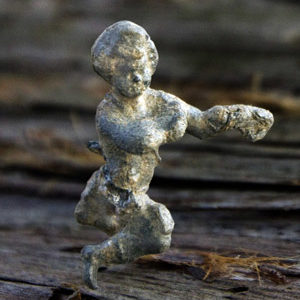Small lead dancing boy with outstretched arm