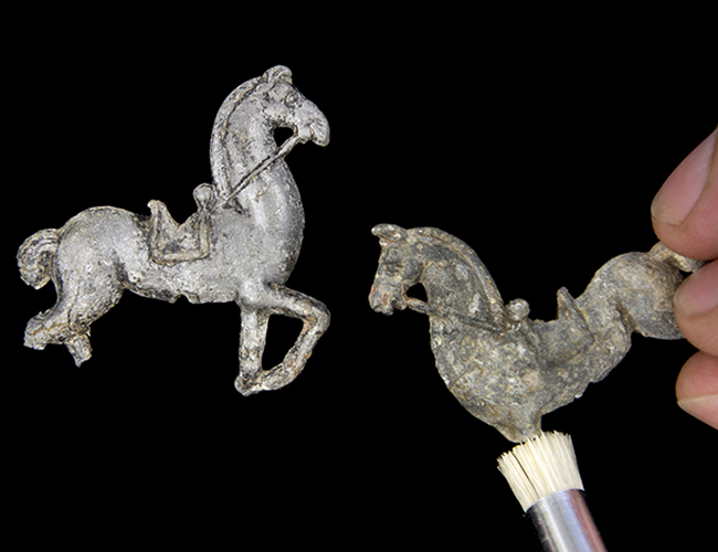 Two cast lead toy horses