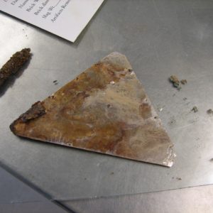 Triangular glass fragment