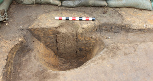 bisected posthole in the corner of an excavation unit