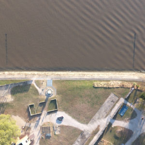 aerial view of the edge of the James Fort site, seawall, and shoreline