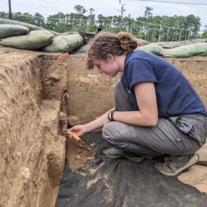 Archaeologist Brenna Fennessey digging at the north Church Tower site.