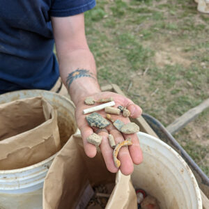 Archaeologist Gabriel Brown shares some of the artifacts found in the excavations near the Colonial Dames of America gate.