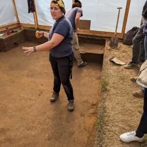 Archaeological Field Technician Hannah Barch explains the latest discoveries in the excavation tent adjacent to the ticketing tent.