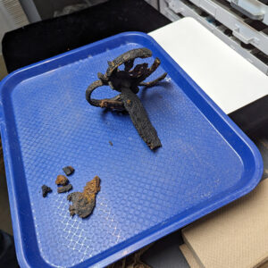 Another of the partial swords found in the Governor's Well. This one is being conserved by Senior Conservator Dan Gamble.