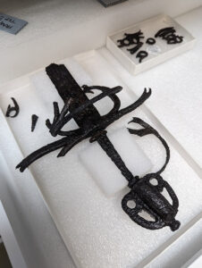 The partial sword from the Governor's Well that Conservator Don Warmke has finished conserving. It is now housed in the Vault's dry room, where temperature and humidity are regulated to inhibit corrosion.