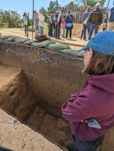 Staff Archaeologist Natalie Reid ponders the soil layers of the 1608 ditch.