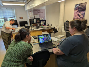 Curatorial Intern Amanda Nedell and Curatorial Assistant Lauren Stephens use software to position an olive jar sherd for pXRF scanning.