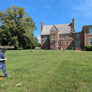 Staff Archaeologists Gabriel Brown and Caitlin Delmas lay out the grid for the GPR survey of Bacon's Castle.