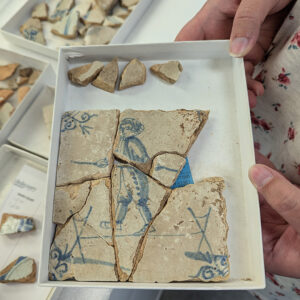 Assistant Curator Magen Hodapp was able to piece together this Delft tile depicting a tightrope walker.
