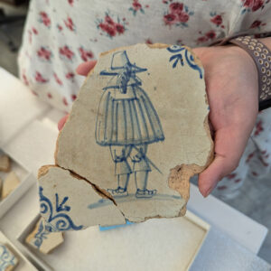 Field school student Kristin Grossi found a mend (bottom left) to this Delft tile depicting a caped gentleman.