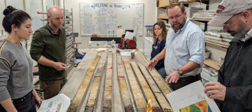 Associate Curator Emma Derry, Director of Archaeology Sean Romo, University of Connecticut's Cassie Aimetti and Dr. David Leslie, and Director of Collections and Conservation Michael Lavin examine the latest batch of vibracore samples from Jamestown.