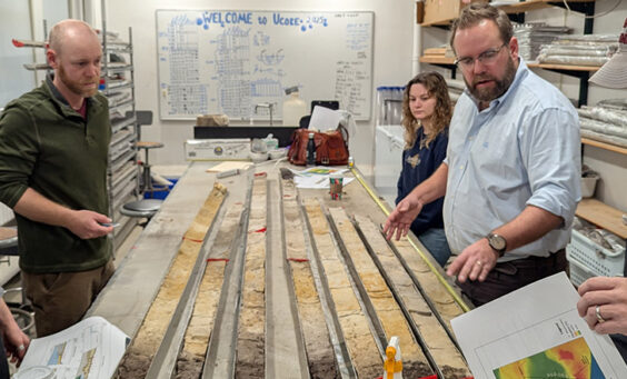 Associate Curator Emma Derry, Director of Archaeology Sean Romo, University of Connecticut's Cassie Aimetti and Dr. David Leslie, and Director of Collections and Conservation Michael Lavin examine the latest batch of vibracore samples from Jamestown.