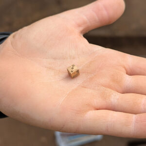 A bone die found at the 1607 Burial Ground site