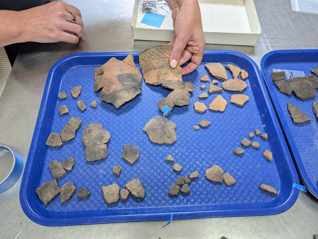 The Potomac Creek pot being mended by Molly Morgan