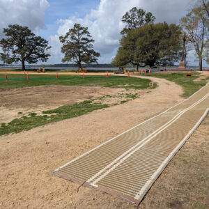 As construction workers construct the new pathway in the distance, a temporary one allows visitors access to the Archaearium museum.