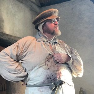 Man in historical surgeon clothing