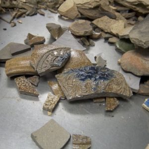 assortment of ceramic sherds on a table