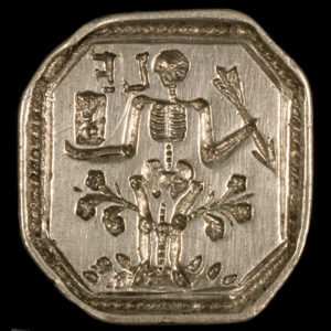 Silver octagonal seal with skeleton holding arrow and standing on floral design