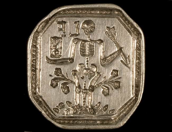 Silver octagonal seal with stamped initials LF and skeleton holding arrow
