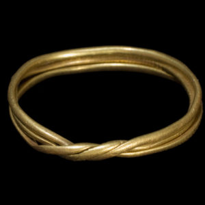 Gold ring on black background