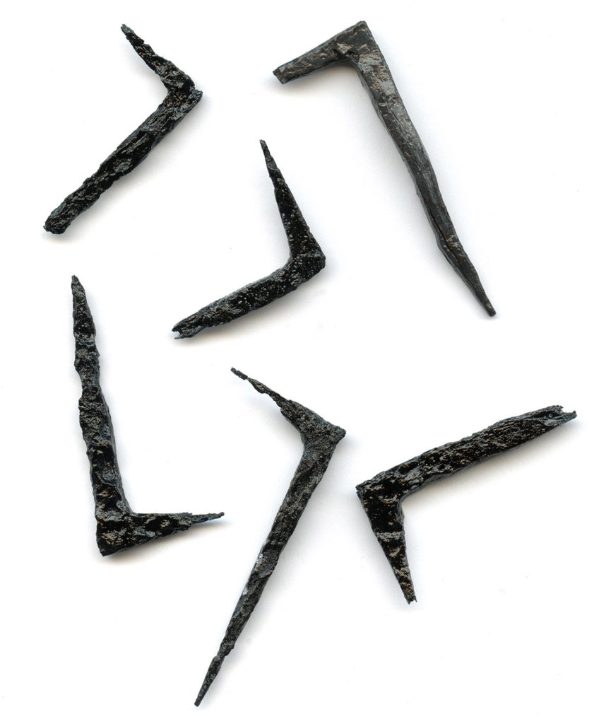 assortment of iron tenter hooks