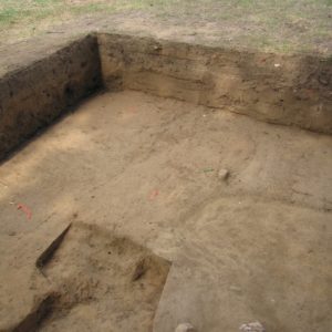 Soil stain of a grave shaft in an excavation unit