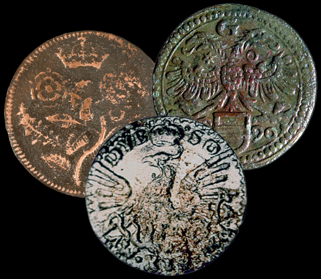 three copper alloy tokens
