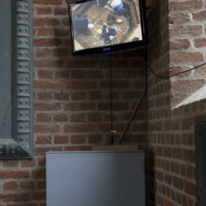 Computer screens mounted inside a brick church