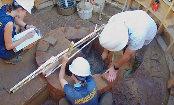 Archaeologists Anna Shackelford, Natalie Reid, and David Givens at the Governor's Well.