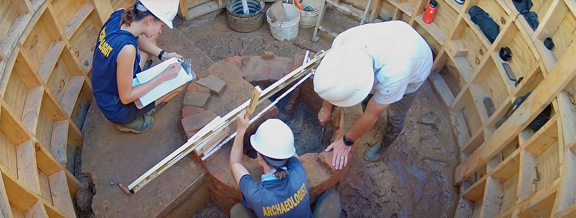 Archaeologists Anna Shackelford, Natalie Reid, and David Givens at the Governor's Well.