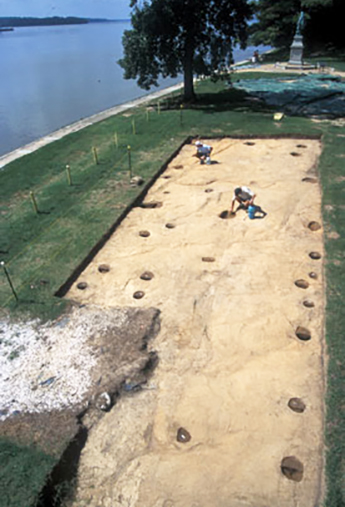 Archaeological excavation showing the posthole patterns from the original barracks structure