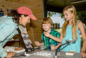 Senior Staff Archaeologist Mary Anna Hartley teaches a hands-on lesson at the Ed Shed.