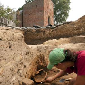 Senior Staff Archaeologist Mary Anna Hartley excavating the close helm