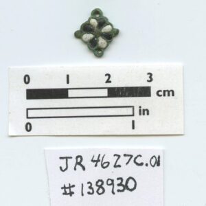 Copper alloy decorative object (likely a jewelry link) after conservation