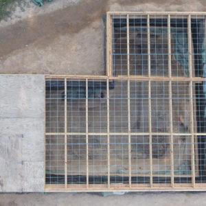 aerial view of a large excavation unit covered with a wooden platform