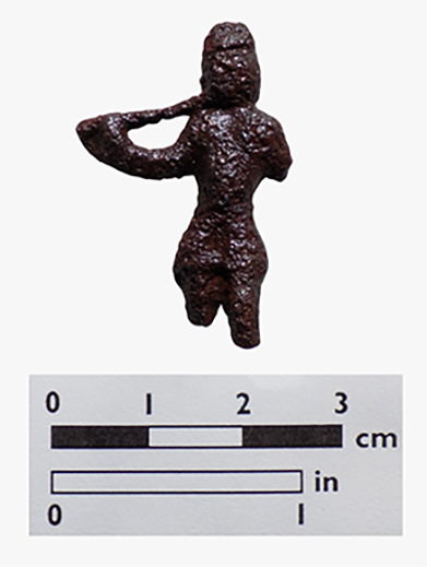 Copper alloy pipe tamp in figure of a man holding a long pipe