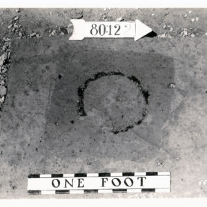 Black and white photograph of excavated circular feature