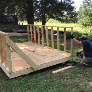 Staff building wooden shed