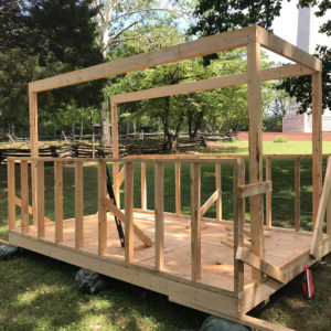 In-progress wooden frame of shed