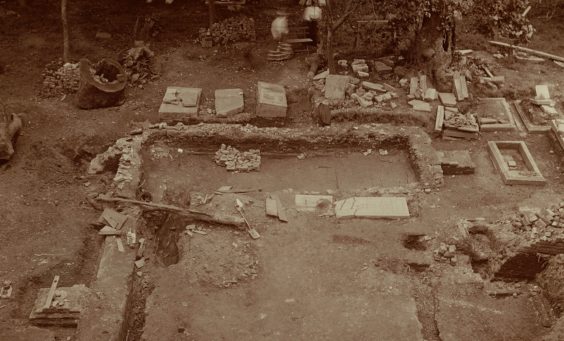 sepia photograph of churchyard excavations