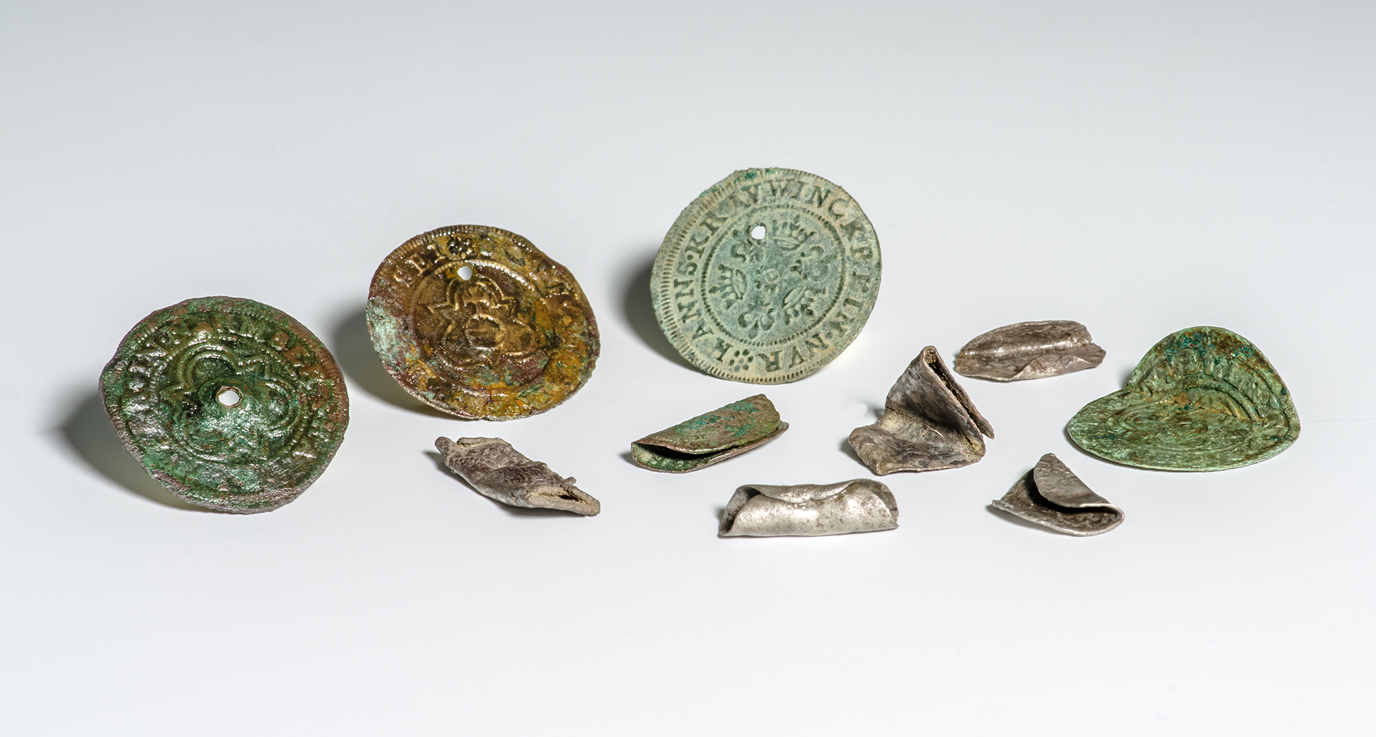 Bent, Rolled, and Pierced Coins and Jettons